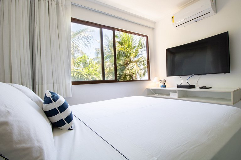 Beachfront Apartment in a Condo with Balcony